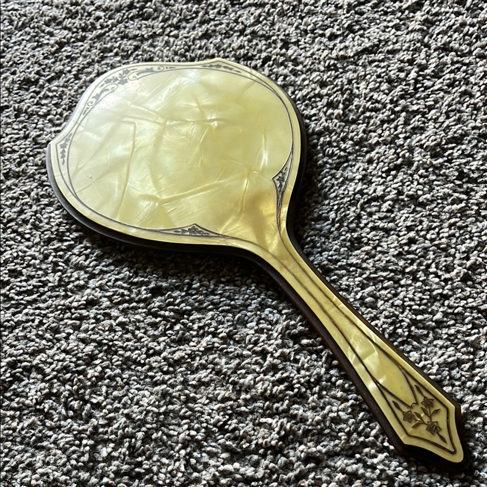 Vintage Handheld Mirror with Intricate Design